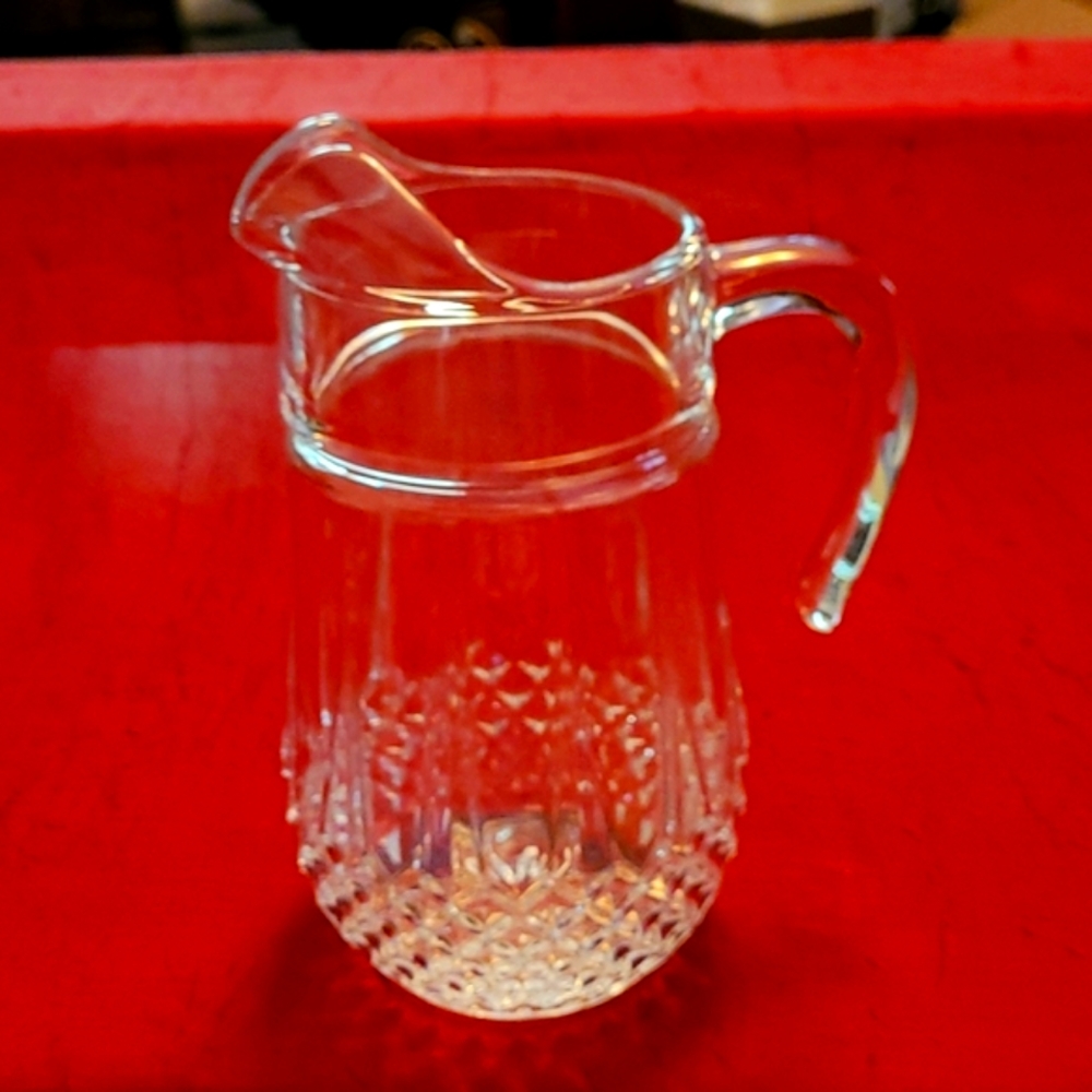 Glass water pitcher.